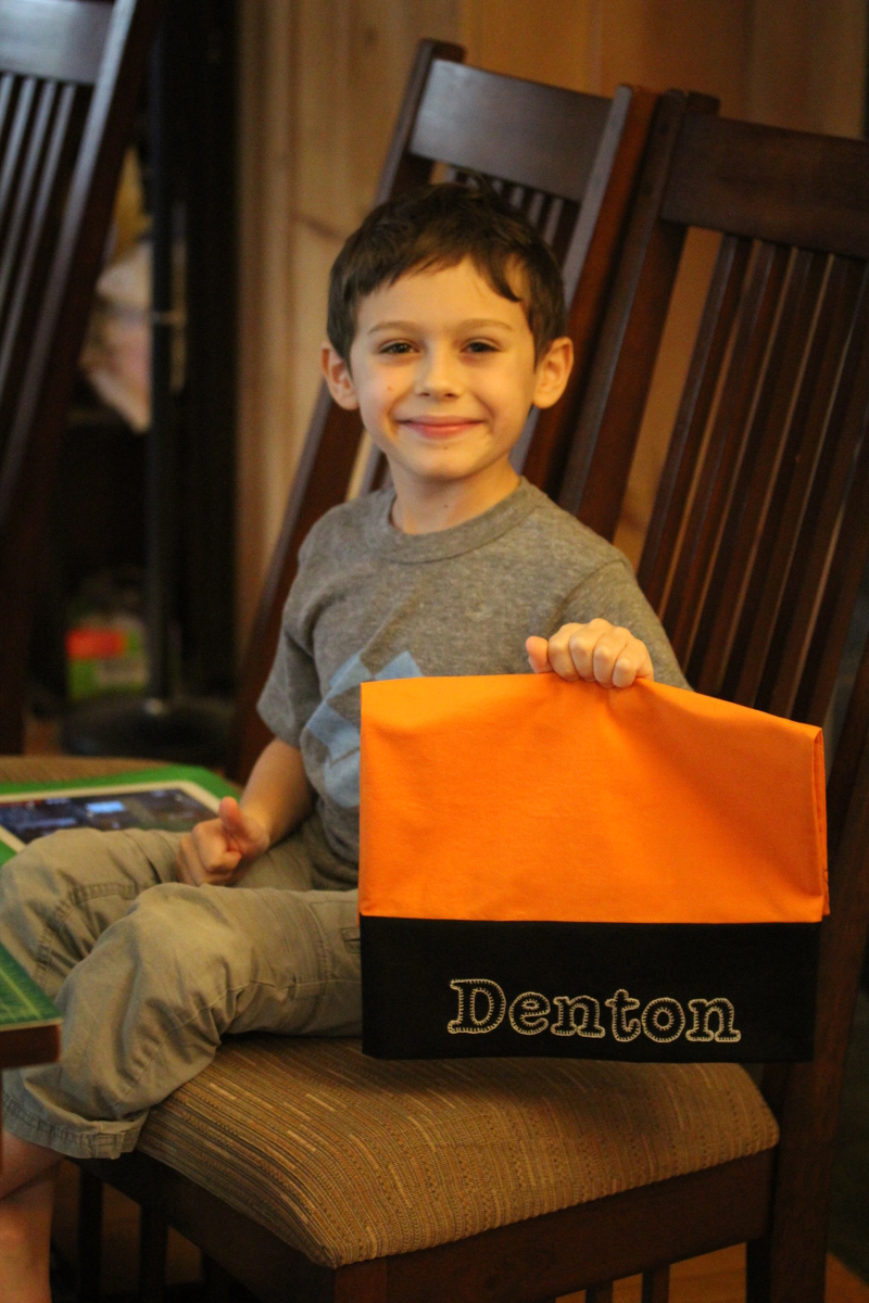 Denton holding a homemade pillowcase
